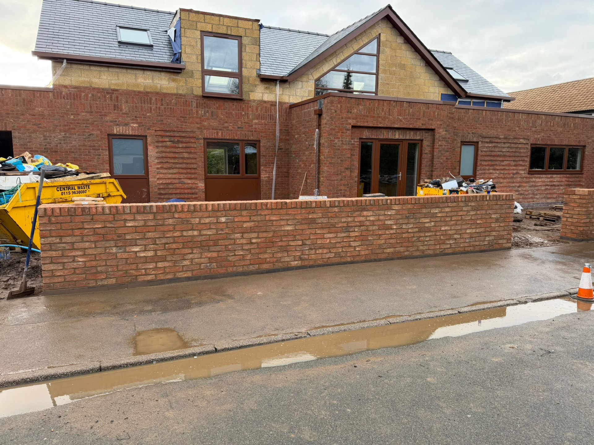 New build development with red brick elevations and boundary wall built by Derby Brickwork Ltd